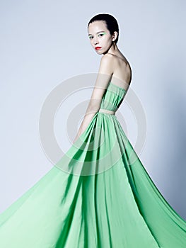 Beautiful asian woman in green dress