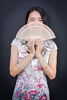 Beautiful Asian woman with a hand fan