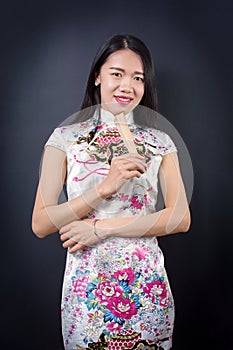 Beautiful Asian woman with a hand fan