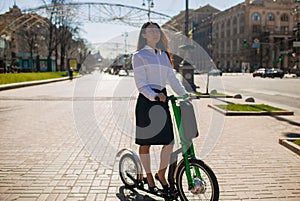 Beautiful Asian Woman in heels Riding An Electric Scooter To Work, Electric Transport