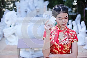 Beautiful asian woman holding dollars or money with lucky pocket money,in the Chinese New Year. Festivities, New Year Celebration