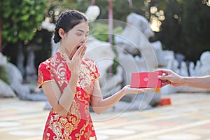 Beautiful asian woman holding dollars or money with lucky pocket money,in the Chinese New Year. Festivities, New Year Celebration