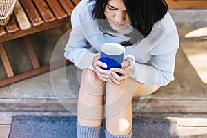 Beautiful asian woman holding and drinking a cup of coffee in the morning,Enjoys of resting time,Close up