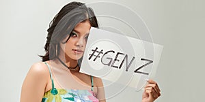 Beautiful asian woman holding a paper with  GENZ