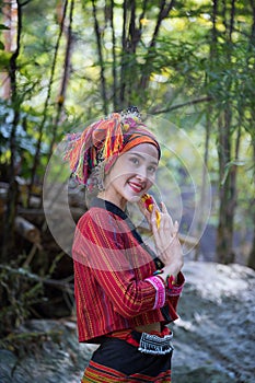 Beautiful Asian woman with karen traditional dress explore in forest in local country Thailand, Asia