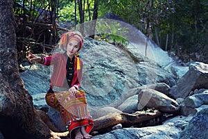 Beautiful Asian woman with karen traditional dress explore in forest in local country Thailand, Asia