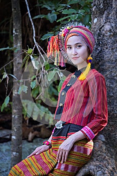 Beautiful Asian woman with karen traditional dress explore in forest in local country Thailand, Asia