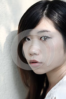 Beautiful Asian woman looking at the viewer photo