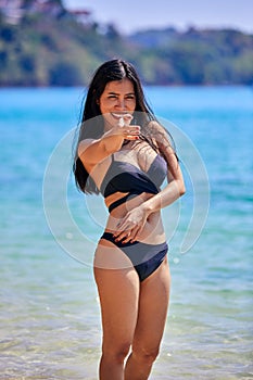 Beautiful asian woman posing on a tropical beach