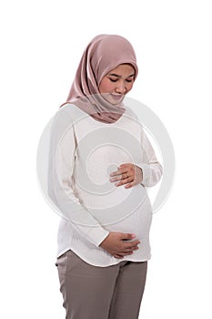 Beautiful asian woman pregnant wearing hijab photo