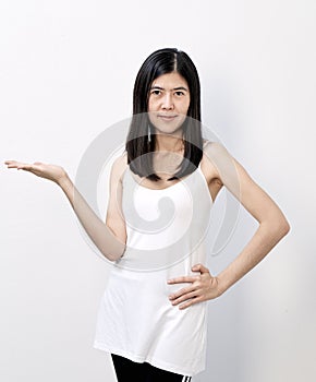 beautiful asian woman presenting copyspace