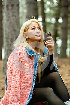 Beautiful asian woman relaxing in the middle of a pine forest