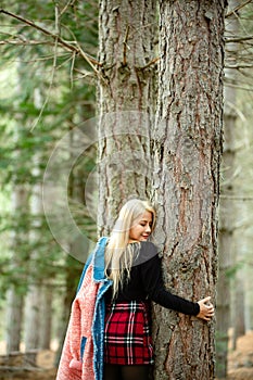 Beautiful asian woman relaxing in the middle of a pine forest