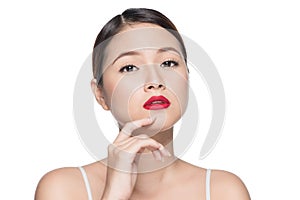 Beautiful asian woman with retro makeup with red lips isolated o