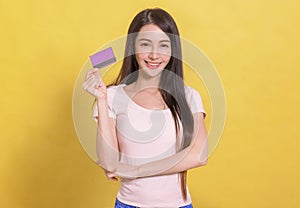 Beautiful Asian woman  showing credit card for making payment or paying online