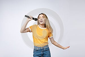 Beautiful asian woman sing a song to microphone, portrait studio on white background.