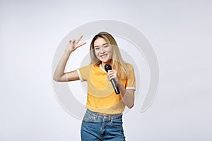 Beautiful asian woman sing a song to microphone, portrait studio on white background.