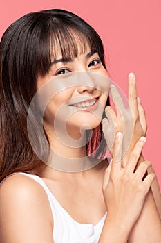 Beautiful Asian woman smile hold hands with clean and fresh skin