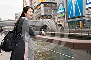 Beautiful asian woman standing at the river