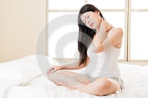 Beautiful asian woman suffering Shoulder neck ache pain tired