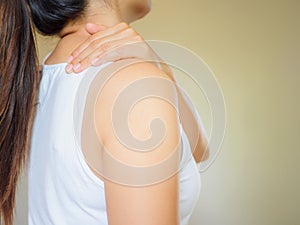 Beautiful asian woman suffering shoulder neck pain