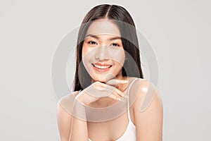 Beautiful Asian woman touching soft cheek smile with clean and fresh skin Happiness and cheerful with positive emotional