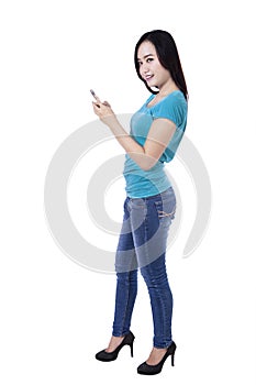 Beautiful asian woman using a mobile phone