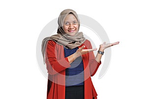 Beautiful Asian woman wearing hijab presenting blank area copy space