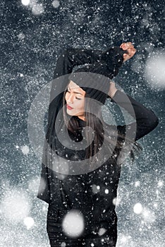 Beautiful asian woman wearing knitted hat with pompom