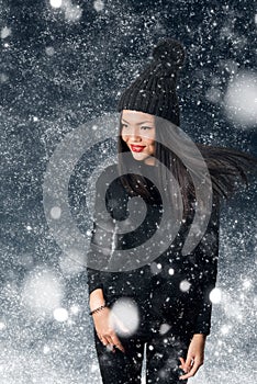 Beautiful asian woman wearing knitted hat with pompom