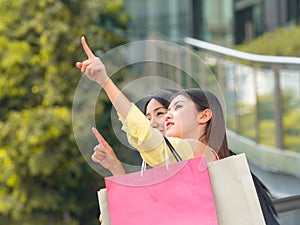 Beautiful asian women are suggesting a place to shopping