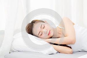 Beautiful asian young woman sleeping lying in bed with head on pillow comfortable and happy.