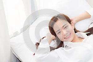 Beautiful asian young woman sleeping lying in bed with head on pillow comfortable and happy.