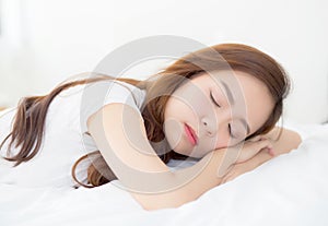 Beautiful asian young woman sleeping lying in bed with head on pillow comfortable and happy.