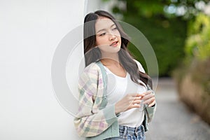 Beautiful asian young woman smile and cheerful. Confident cute female looking at camera relax and happiness with wellness life.