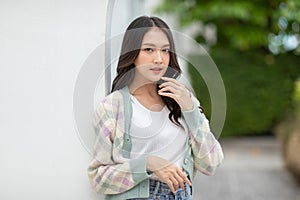 Beautiful asian young woman smile and cheerful. Confident cute female looking at camera relax and happiness with wellness life.