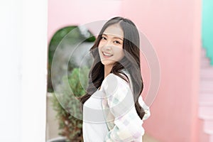 Beautiful asian young woman smile and cheerful. Confident cute female looking at camera relax and happiness with wellness life.