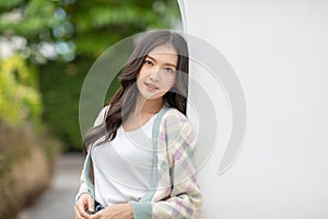 Beautiful asian young woman smile and cheerful. Confident cute female looking at camera relax and happiness with wellness life.