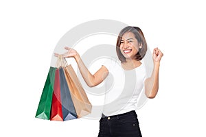Beautiful asian young woman smiling holding shopping bags isolated on white background