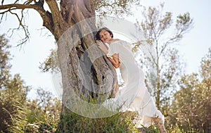 Beautiful Asian young woman in white dress outdoor