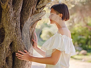 Beautiful Asian young woman in white dress outdoor