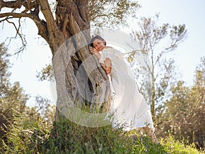 Beautiful Asian young woman in white dress outdoor