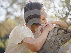 Beautiful Asian young woman in white dress outdoor