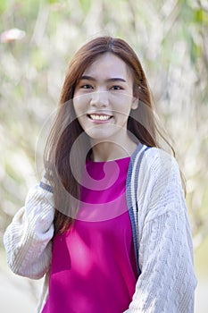 Beautiful asian younger woman toothy smiling face with happiness