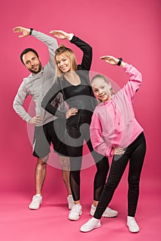 beautiful athletic family exercising