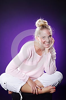 Beautiful athletic woman sitting on floor