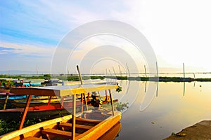 the beautiful atmosphere of the morning on Lake Rawapening with a boat that is anchored. boats on the lak