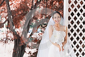 Beautiful Attractive Asian Bride Woman wearing white wedding dress