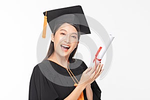 Beautiful Attractive Asian woman graduated in cap and gown smile with certificated in her hand feeling so proud and happiness,