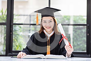 Beautiful Attractive Asian woman reading book to learn for education